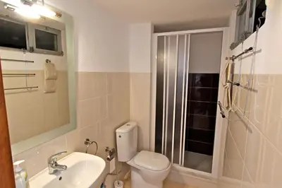 a bathroom with a toilet and a sink and a shower at Villa Violeta 51 - Clever Details in Vilamoura