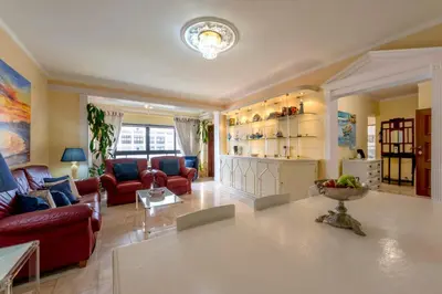a living room with a couch and a table at Blue Boat in Quarteira