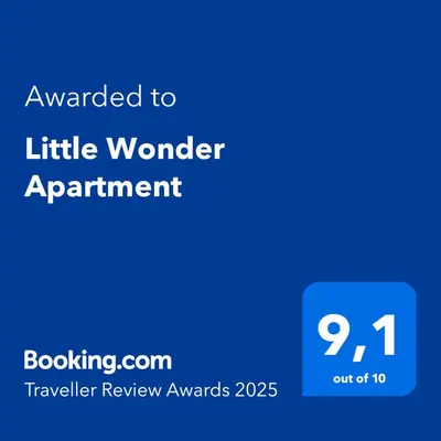 a blue sign with the words awarded to little wonder apartment at Little Wonder Apartment in Albufeira