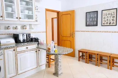 a bathroom with a sink and a mirror at Avenue Apartment in Quarteira