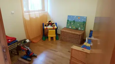 a childs room with a table and a chair at Albufeira Marina Villa 27 in Albufeira