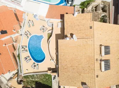 an aerial view of a city and the ocean at ETHOS Bertolina Wellness Urban Living in Albufeira