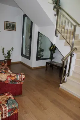 a living room with a staircase and a couch at Dom Fernando II in Loulé