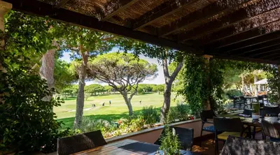 a view of the golf course from the patio at Algarve Luxury Experience - Situated within the Pinecliffs Resort in Albufeira
