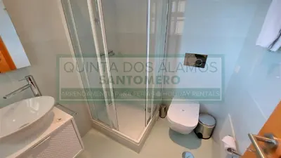 a bathroom with a shower and a toilet at Moradia Townhouse Vila Rosal 2 in Albufeira