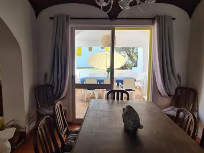 a figurine sitting on a table in a dining room at Aldeia do Golf - Vila I4 in Vilamoura