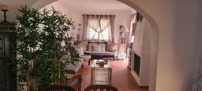 a living room with a couch and a table at Aldeia do Golf - Vila I4 in Vilamoura