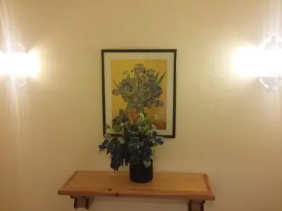 a vase of flowers on a table in a room at Bellavista Tenis Clube A4 T1 - Albufeira INN in Albufeira