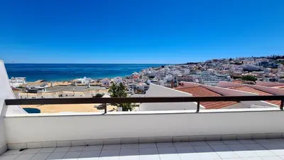 a view of the ocean from the balcony of a house at Albufeira Cerro Branco (23) in Albufeira