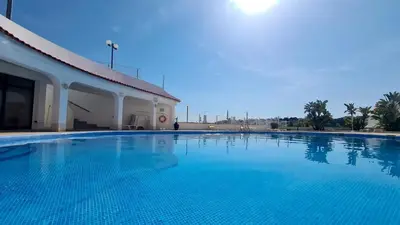 a large swimming pool next to a building at Albufeira Cerro Branco (23) in Albufeira