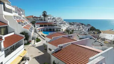 arial view of a city with houses and the ocean at Albufeira Cerro Branco (23) in Albufeira