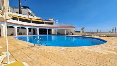 a large swimming pool on the side of a cruise ship at Albufeira Sea view (51) in Albufeira