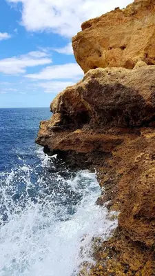 a rocky cliff next to the ocean at Albufeira Sea view (51) in Albufeira