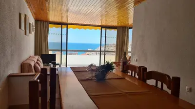 a living room with a view of the beach at Albufeira Sea view (51) in Albufeira