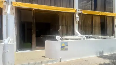 a patio with tables and chairs in a building at Albufeira, Cerro Branco (41) in Albufeira