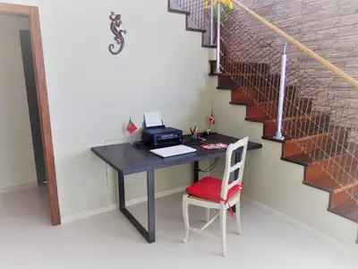 an office with a desk with a computer and a staircase at Quinta Sabaudia in Gateiras
