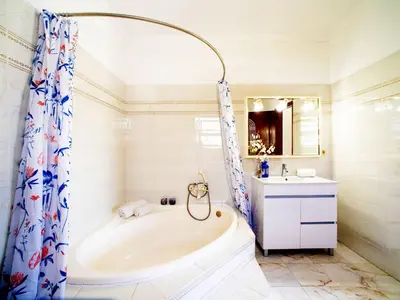 a white bathroom with a tub and a sink at Holiday Home Da Bela Vista by Interhome in Paderne