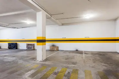 an empty room with yellow and white stripes on the walls at Ouranascente in Albufeira