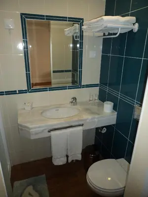 a bathroom with a sink and a toilet at VilaBranca in Albufeira