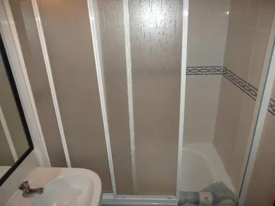 a bathroom with a shower and a sink and a toilet at VilaBranca in Albufeira