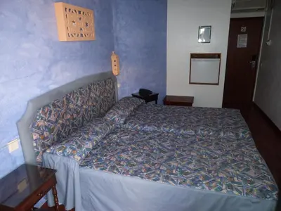 a bedroom with a bed in a blue room at VilaBranca in Albufeira
