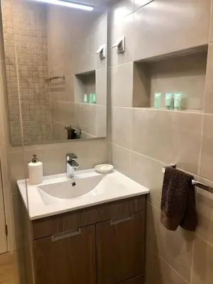 a bathroom with a sink and a mirror at Apartamento 24 SOL in Vilamoura