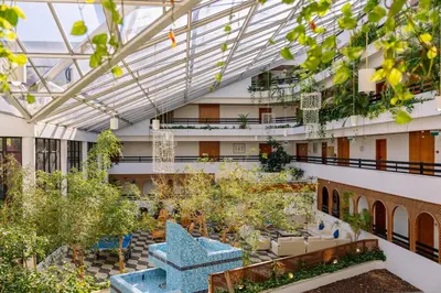 an indoor garden in a building with plants at Muthu Oura Praia Hotel in Albufeira