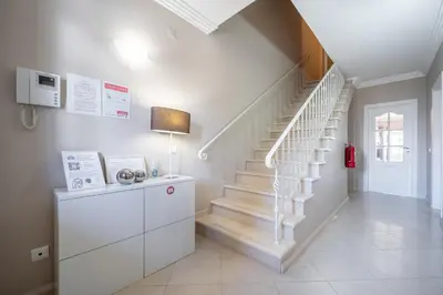 a staircase in a home with white walls at Villa Balaia by HelloVacations in Albufeira