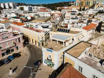 an aerial view of a city with buildings at Casa Beny 1897 Guesthouse in Loulé