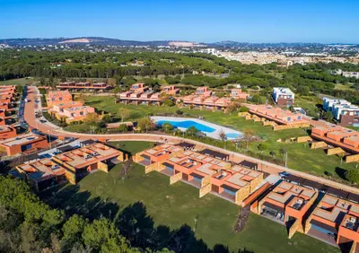 an aerial view of a building with a pool at L Orangerie CA by Intiholidays in Vilamoura