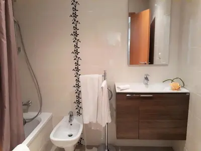 a bathroom with a sink and a toilet and a shower at T1 V do Forte AC&Piscina&Garagem in Quarteira