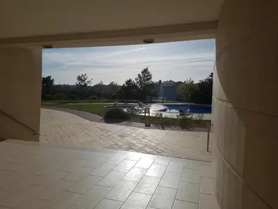 an open door to a patio with a view of a pool at Monte da Eira in Albufeira