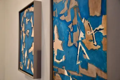 a painting hanging on a wall in a room at Aquamarine - Gemstone Getaway in Vale do Lobo