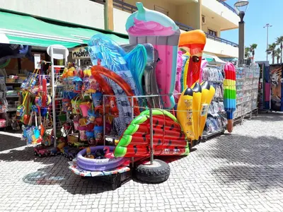 a market with a bunch of colorful items on display at Avenida Mar- Vista Mar, Wifi, 150mt Praia in Quarteira