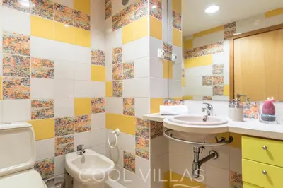 a bathroom with two sinks and a toilet at Marina Water View - 6 people, bars & restaurants in Albufeira