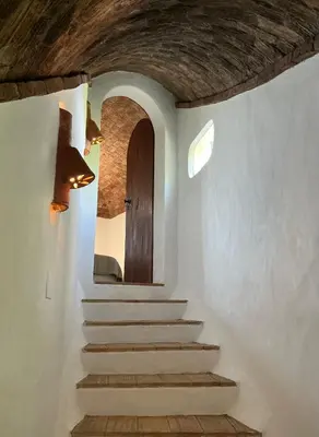 a stairway with a door in a room at Monte Borboleta - Villas, Apartments in Faro