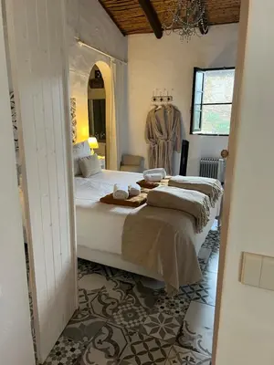 a bedroom with a large bed in a room at Monte Borboleta - Villas, Apartments in Faro