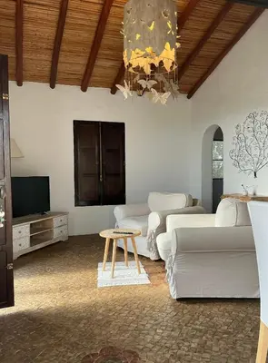 a small white church with a blue door at Monte Borboleta - Villas, Apartments in Faro