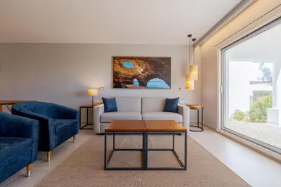 a living room with a couch and a table at Hapimag Resort Albufeira in Albufeira
