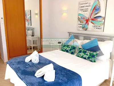 a hotel room with a bed with towels on it at Moradia Townhouse S Sebastião F in Guia
