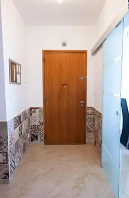 a wooden door in the middle of a room at Old Town Sant'ana T2 in Albufeira