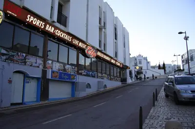 a car parked on a street next to a building at Estrela do Mar in Albufeira