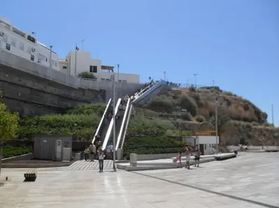 a group of people walking up a stairway at RosaMar apartment sea view and pool in Albufeira