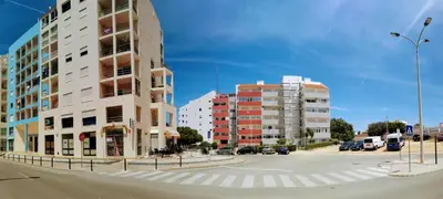 an aerial view of a beach with a crowd of people at Musa Mar studio with balcony panoramic view in the residential area in Quarteira