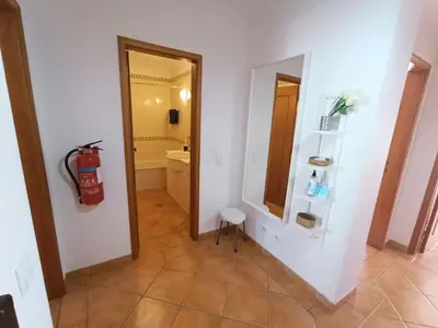a room with a bathroom with a fire hydrant on the wall at Beauty by the Sea in Albufeira