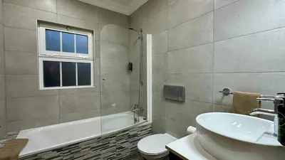 a bathroom with a tub and a sink and a toilet at Fonte Santa by Check-in Portugal in Quarteira