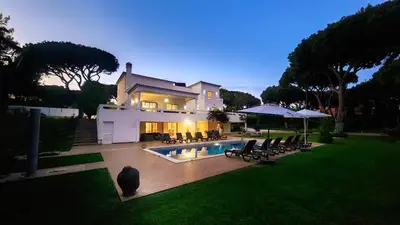 a large house with a swimming pool in the yard at Fonte Santa by Check-in Portugal in Quarteira
