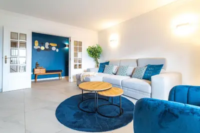 a living room with a couch and a table at Casa beira mar Algarve in Albufeira