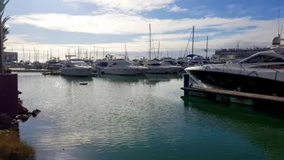 a bunch of boats docked in a harbor at Marina Apartment in Quarteira