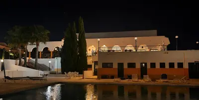 a bedroom with two beds and a closet at Rialgarve in Faro